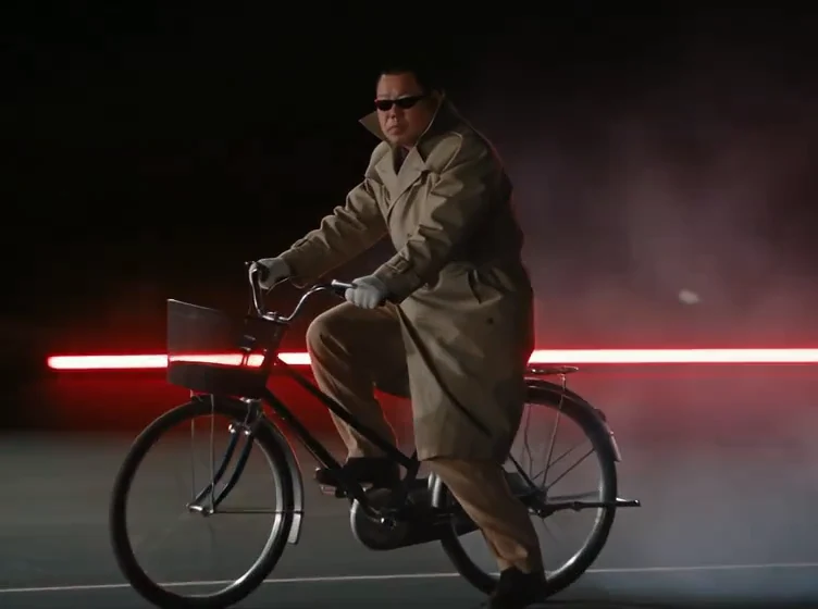 Built-in Roadster AI reference ending, showing a closer view of the rider's face, coat and bicycle